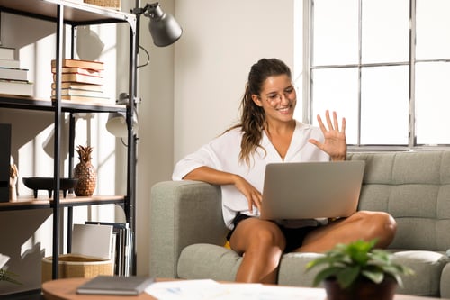 female-sitting-couch-with-laptop-1
