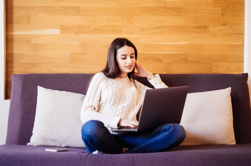 side-view-woman-with-laptop-home-3